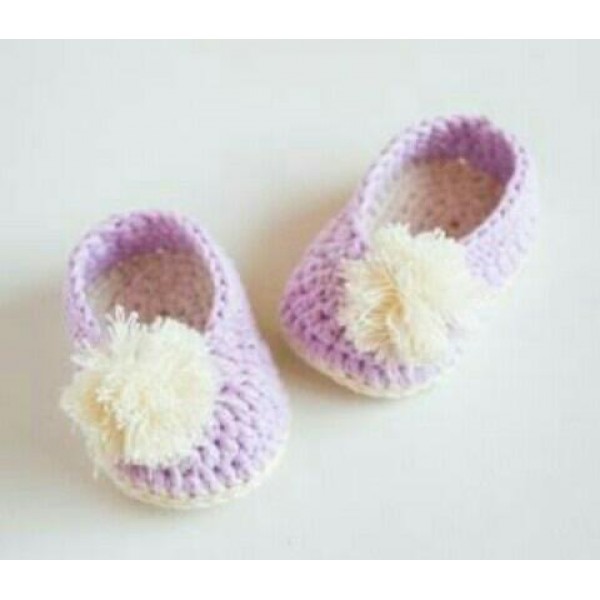 baby shoes with pom poms